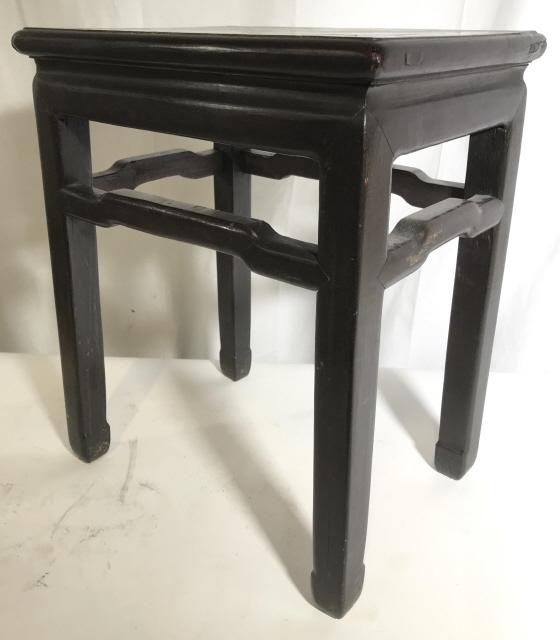 Hand Crafted Vintage Carved Asian Side Table: Side table is brown toned and wooden. Piece has high stretchers and carved wooden feet. Piece measures approximately 19 inches tall 16 inches wide 12 inches deep. Asian Side Table, end table, wooden s
