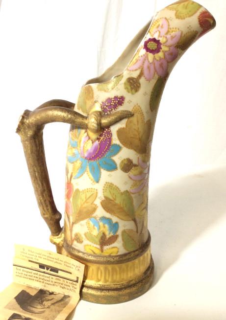Royal Worcester Porcelain Tusk Jug, Signed: Outlined embossed dotted paint pattern, outlines all floral detail, Gilt detail, all hand painted in Moorcroft style. Organic branch handle. Comes with newspaper Clip about the item such as this. Art 