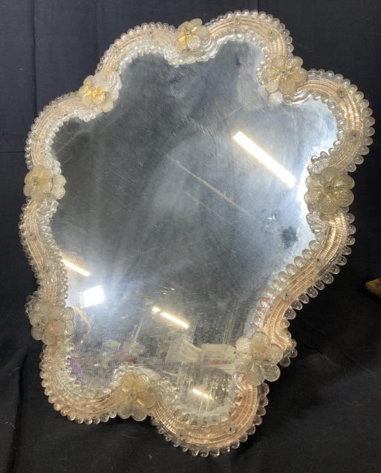 Antique Venetian Art Glass Flower Mirror: Antique murano gold toned art glass wall mirror, Glass mirror with flower pattern rim, venetian glass, italian mirror, handcrafted, gold toned, floral wide banding, organic shape. Wooden back. Measure