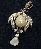 14 k Pearl And Rhinestone Pendant: Floral design frame with rhinestones, organically shaped pear center and drop charm, silver toned metal on front, gold tone on reverse. No hallmark. Measures approx 1 in long. ladies vintage estate je