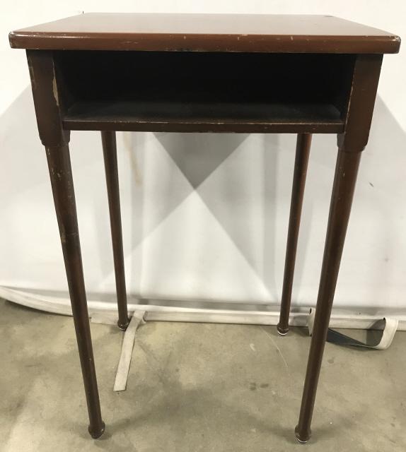 Vintage Carved Wooden Side Table: Side table is brown toned and wooden. Piece has open storage space in front. Piece has 4 carved wooden legs and feet. Side table, end table, vintage side table. Piece measures approximately 29 inches 
