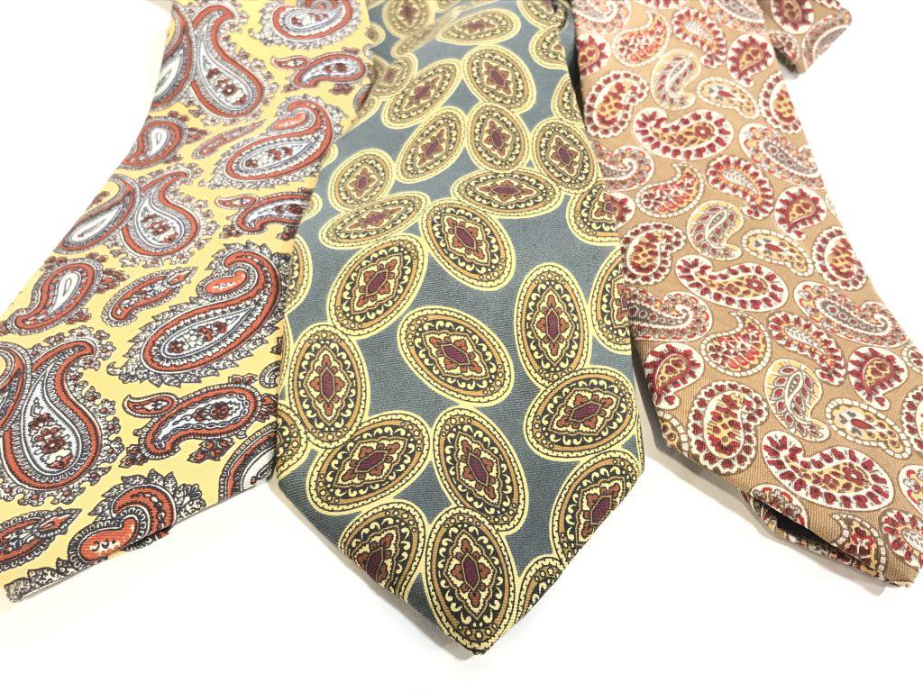 Lot 3 English Paisley Silk Dress Ties, Burberry: Yellow a Tie with rust and blue tone paisleys. Labeled English Silk Foulard. Burberry of London Hand Sewn Tie, Burberry of London label and fabric label, 100% Silk, Green with brick and yellow design.