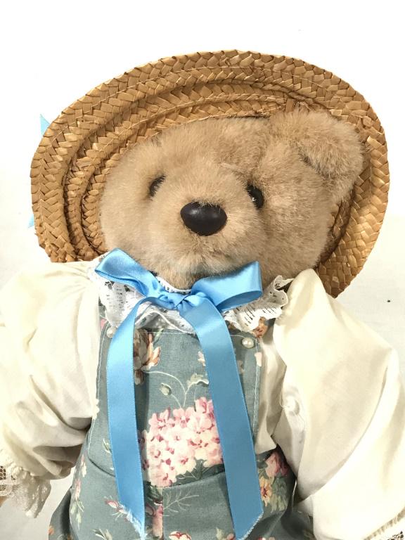 Bearly People Collectible Plush Bear In Overalls: Comes with Doll Stand. Bear has straw hat with blue ribbon, blue overalls with pink roses, pearl style buttons, 16 in. long on stand. App 1 in. wide. Bearly People Collectibles, Plush Bear, Teddy Bear