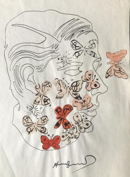 Signed Ink & Watercolor After Andy Warhol: Signed Ink and possibly watercolor sketch/painting/print, signed in pencil under black ink, depicting a drawing of a face with orange and pink butterflies over the top, Signed Andy Warhol in lower edg