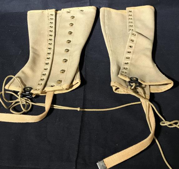 Pair Vintage KING KARD OVERALL CO. Shin Guards: This is a pair of KING KARD OVERALL CO. vintage shin guards. The pieces appear to be made from a canvas material. The labels both date the pieces as having been manufactures in January 1941. The piece