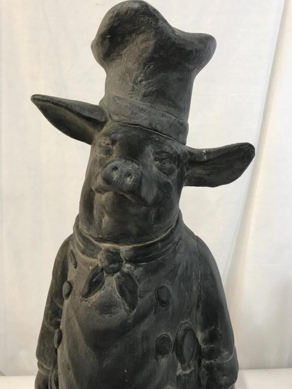 Tall French Character Plaster Pig Statue, c. 1920: 2 ft tall grey ceramic pig wearing an apron, chef’s hat & handkerchief. Underside has protective felt. No surface issues. App 9.5 in. wide, 9 in. deep. Org. use was an advertising display c. 1920, F