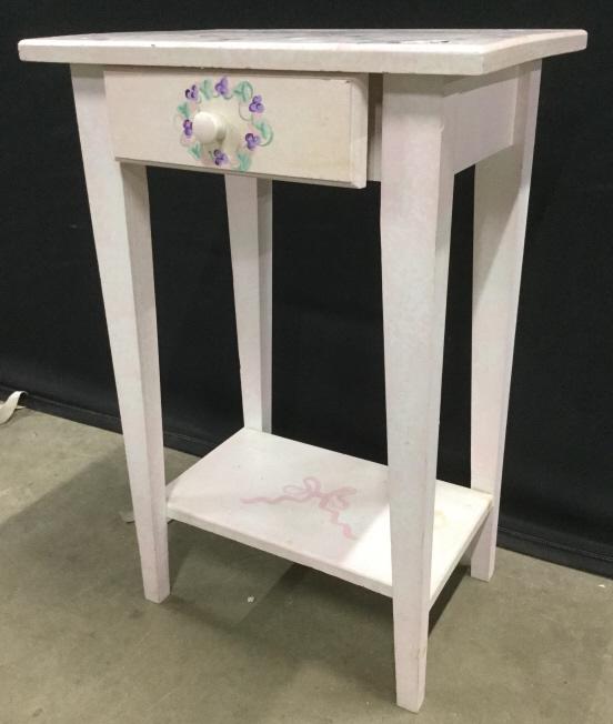 Vintage Floral Detailed Wooden Side Table: Table is pink toned with multi toned floral detail. Side table has 1 drawer. Floral table, floral side table wooden side table, vintage side table. Piece measures approx 27 inches tall 18 inches wide 