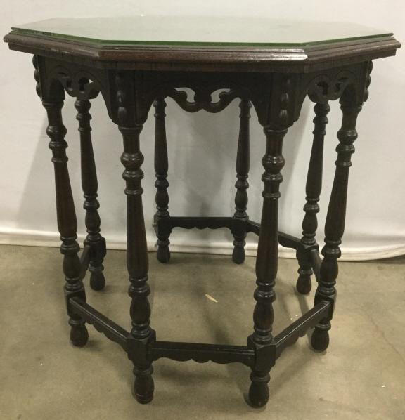 Antique 8 Leg Carved Wooden Octagonal Table: Table has intricately carved wooden detail. Table has Octagonal shaped top. Piece includes glass top. Piece has carved wooden feet. Piece has carved wooden stretchers. Antique table, antique Octagonal