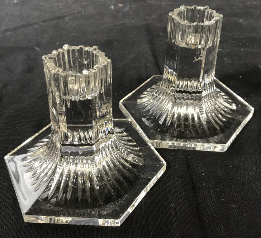 Lot 3 Signed Tiffany & Co. Tableware: Pair hexagonal crystal candlestick holders. 4 in. wide. One candlestick marked ‘Lotus Comfort Tiffany Collection Tiffany & Co.’ Stamped in white. Embossed Heart border design, crystal bowl, marked