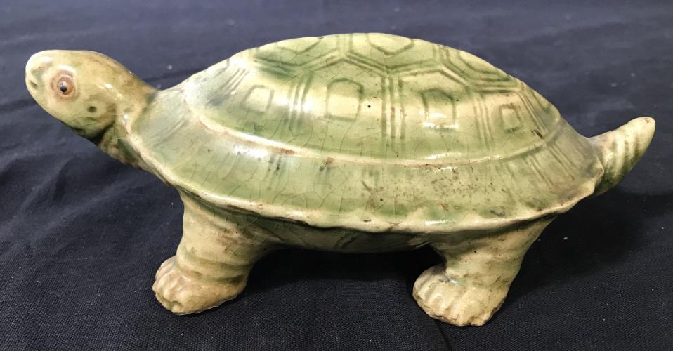 Vintage Glazed Ceramic Turtle Sculpture: This is a vintage, possibly antique, ceramic turtle sculpture, the piece is glazed and hand painted. The turtle has been colored in olive green tones. The piece measures approx 2.6 inches H, 4.25 inch