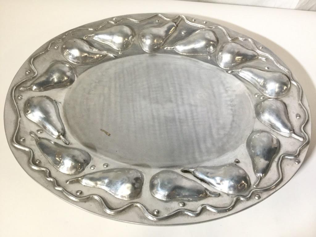 MARIPOSA BRILLANTE Pewter Pear Tray: Underside is marked MARIPOSA BRILLANTE. Piece is silver toned. Contains beveled pear detail around rim. Tray is pewter. Measures approximately 23 inches long 18 inches wide. tableware, serving tray, d