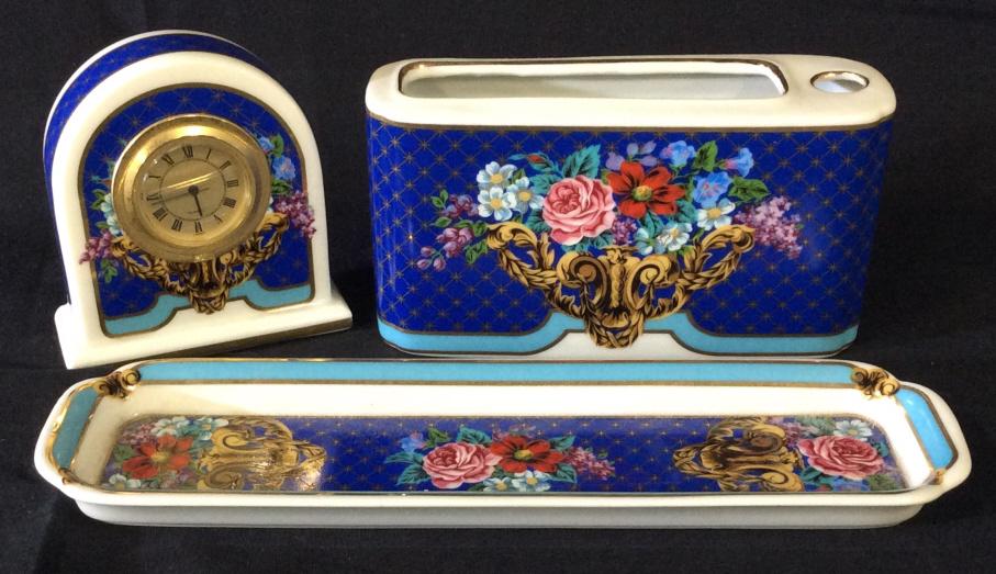 Neiman Marcus Painted Porcelain Desk Set, 3: Hand painted porcelain set, Pen/ Letter Opener Tray, paper and pen holder, quartz clock. Painted, rich color, labels on underside read Neiman Marcus Japan. Piece 1 , 8 3/4 in long. Porcelain Desk Set,