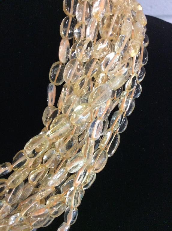 Kenneth Lane Twisted Quartz Bead Neck, Jewelry: Signed Charm reads Kenneth Lane. Natural Quartz, possibly Citrine, Of 9 mm sized beads. Tests positive on Gem tester for quartz. Multi Strand, over 10, hook and loop clasp, 17 in. long. Heavy piece. N