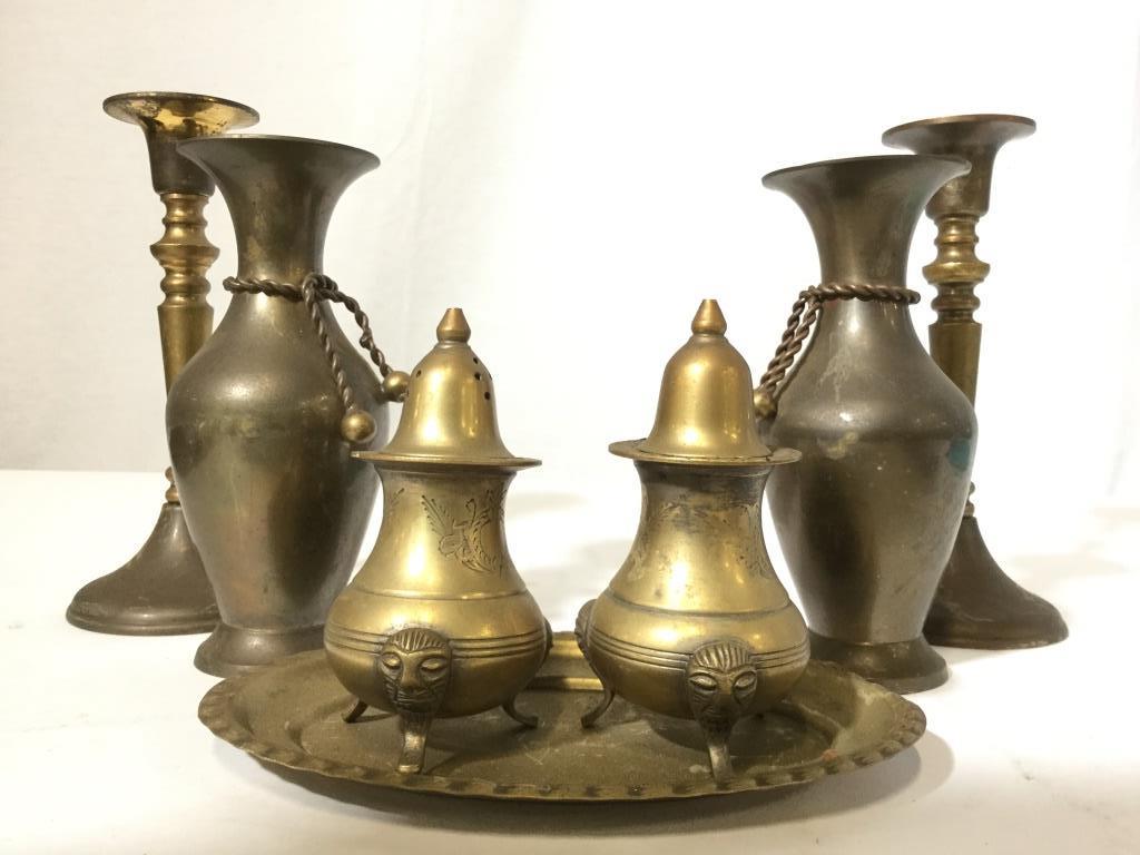 Lot 7 Gold Toned Tabletop Accessories: Lot includes 2 Decorative Vases, 2 Candlesticks, 1 salt & 1 pepper shaker, & 1 oval shaped dish. Salt & pepper shakers have 3 feet. Each piece is gold toned and possibly brass. Some pieces are marked 