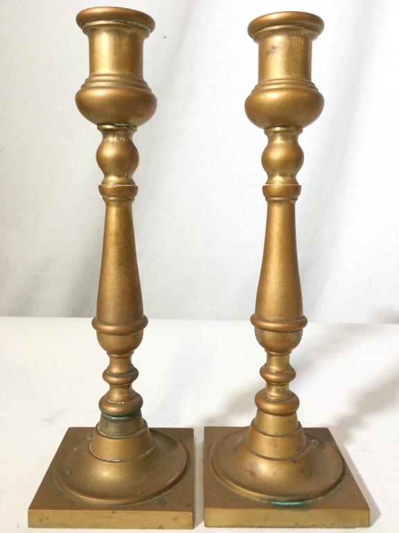 Pair Gold Toned Brass Candlesticks: Lot includes 2 Candlesticks. Candlesticks are gold toned and brass. Candlesticks, Brass Candlesticks, mantle piece decor, shelf piece tabletop accessories. Each measures app 11 inches tall 4 inches sq