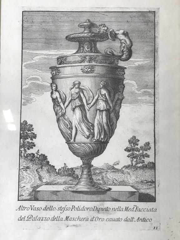 Framed Roman Neo Classical Ink On Paper, Italy: Gilt and whitewashed Beveled wood frame with carved scrolls to corners. Ink print depicts colossal Urn with semi nude goddesses holding hands. Stenciled writing in Italian Reads ‘Altro Vaso dello st