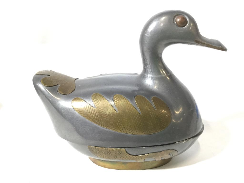 Silver & Gold Toned Pewter Duck Keepsake Box: Trinket Box is pewter. Contains tones of silver and gold. Piece measures approximately 5 inches long 4 inches tall. animal figural, trinket dish, keepsake box, candy dish, tableware, tabletop accessor