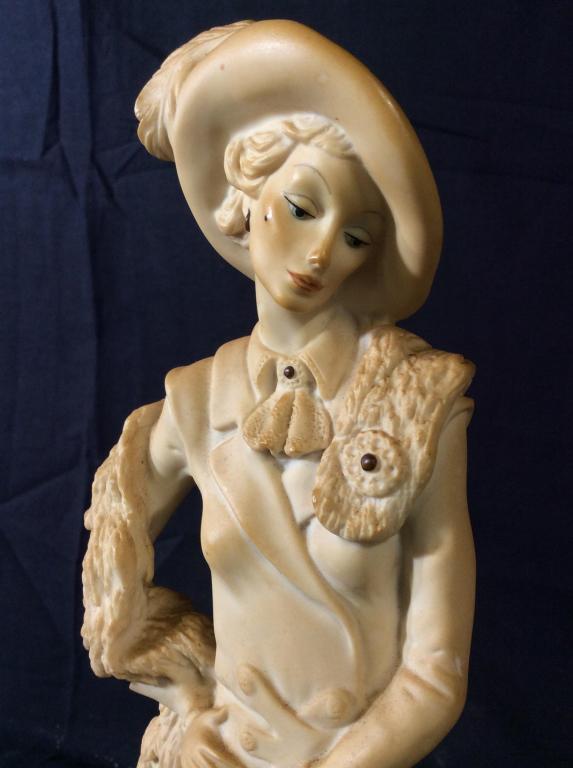 Signed Giuseppe Armani Female Sculpture: Piece is signed GIUSEPPE ARMANI. Piece depicts a standing female figure next to a Seated Poodle. Piece appears to be composite. Piece appears to be vintage. Measures approximately 14 inches tall 4 inc