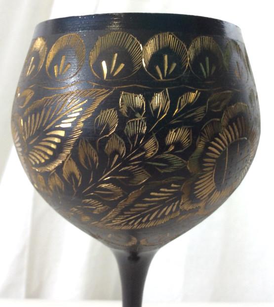 Vintage Metal Chalice W Gold Toned Floral Relief: Piece is black toned with gold toned etched floral and leaf relief detail. Piece has slim stem. Measures approx 11.5 inches tall 4 inches wide. Stemware, Metal Stemware, Metal chalice, Etched Artwork.