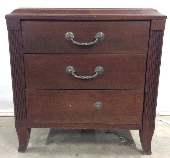 Vintage ETHAN ALLEN 3 Drawer Wooden Side Table: Interior of top drawer reads ETHAN ALLEN. Side table is wooden. Piece is chocolate toned. Contains 3 drawers. Piece has hanging metal drawer handles. Drawers appear to have hand dovetailing. Piece mea