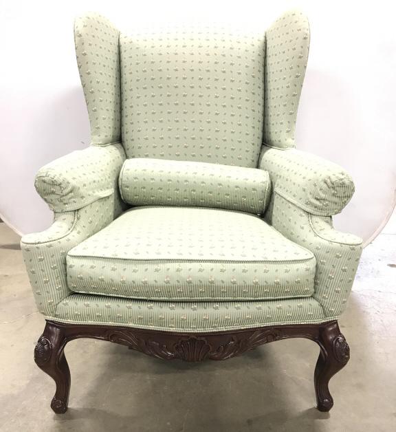 Vintage Century Wingback Chair: Vintage Century Wingback Chair In sea foam green and floral upholstery with welted trim and carved wooden base, marked under cushion Century Hickory, NC, small nicks to legs, measures approximately 46