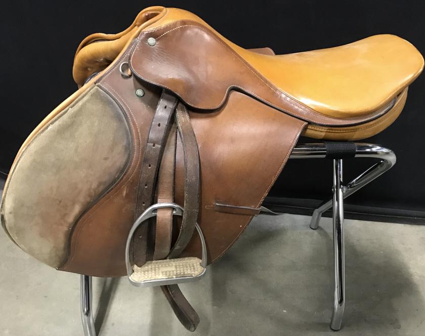 Vintage W & H GIDDEN Leather Saddle, England: This is a vintage W&H GIDDEN leather saddle. The piece was manufactured in London. The seat measures approx 18.25 inches. The piece measures approx 26.5 inches W, and 20 inches H. There is some wear p