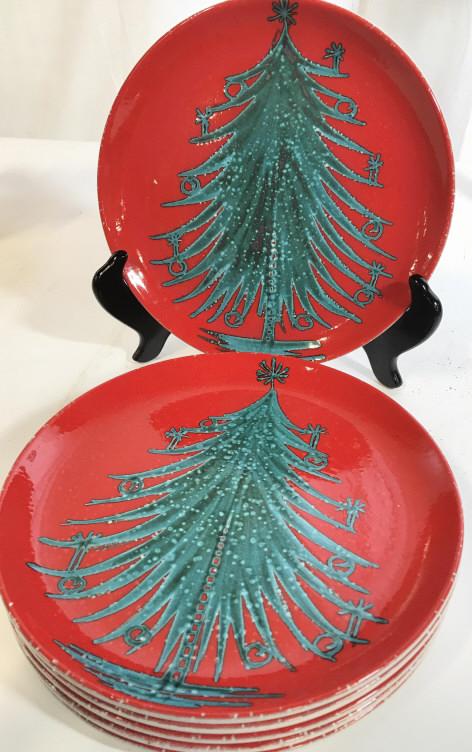 Signed Christmas Tree Porcelain Plate Set 6, Italy: Red ceramic plates with Center a Christmas Tree. 8.5 in. Hand crafted in Italy. Underside reads ‘made in Italy, T.K.C., LL/71’ solid thick ceramic. Italian Ceramics, Holiday Table Decor & Accessor
