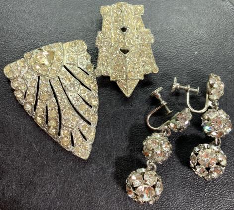 Lot 3 Vintage Rhinestone Accessories, Jewelry: c 1920's, two shoe clips, do not match, some yellowing and missing rhinestones, larger clip is missing back clip. Set in silver toned metal, art deco design. larger measures approx 2 in by 1 1/2 in. P