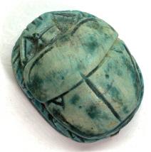 Egyptian Style Carved Scarab Beetle Figural: Appears to be blue toned ceramic material, with etched hieroglyphic characters and details. Some surface wear measures approx 1 in by 3/4 in. figural, egyptian style figural, collectible, collectibles