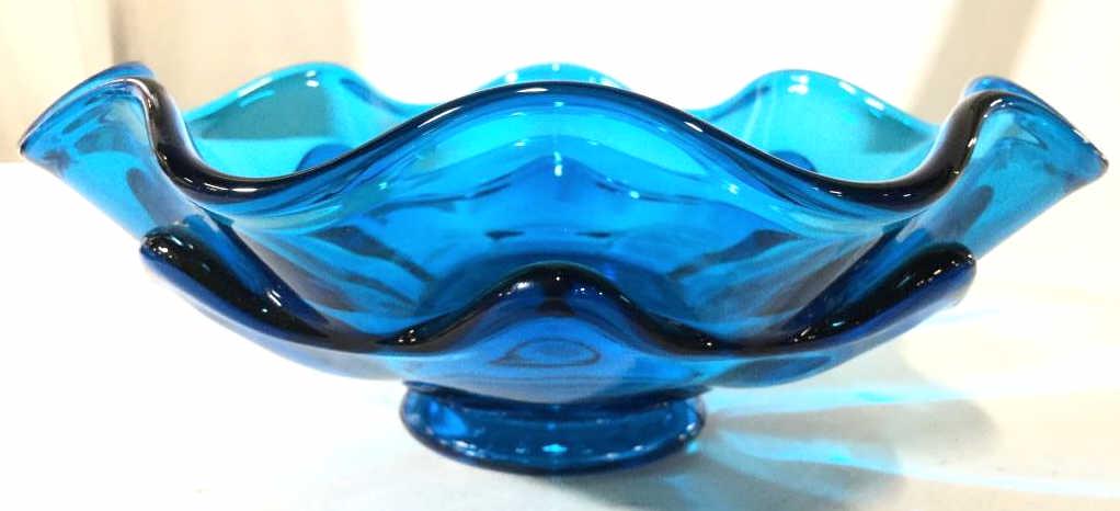 Aqua Toned Frilled Rim Art Glass Bowl: Bowl has a dark aqua tone. Piece has slightly frilled rim. Art glass, art glass bowl, Trinket dish, glass trinket dish. tableware, decorative accessories, home accent, art glass Piece measures approxi