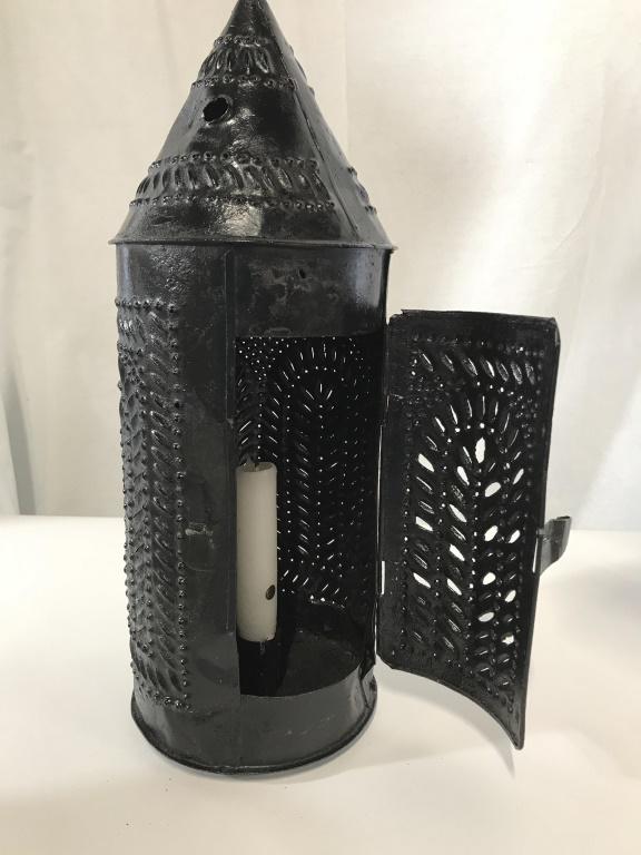 Pierced Metal Table or Hanging Lantern: Lightweight black painted lantern, Pierced metal, tapered candle, door that opens. Needs chain to hang. 15 in tall, 5.25 in wide. Lantern outdoor candle lighting patio indoor lantern table lantern han