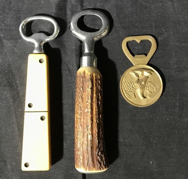 Lot 5 Bottle Openers, Corkscrews, Barware: This lot includes several corkscrews and bottle openers. Each piece is or a different design. The largest piece measures approx 6.75 inches H, and 2.3 inches W. There is a degree of wear present due t