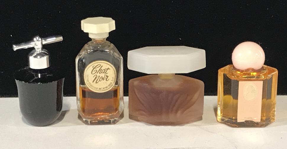 Lot 4, 5 ml Designer Perfumes: Approximate size is 5ml. Includes Chat Noir, Caesars, Liz Claiborne, White Shoulder. 2 bottles full. Hard to see dark blue bottle. Ladies Perfumes, EDT, cosmetics, Vanity, Fragrance, Designer Perfume 