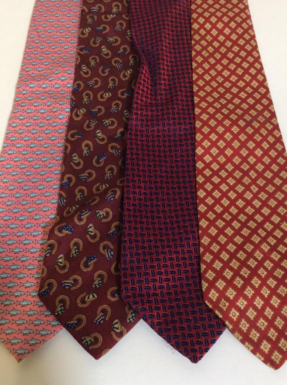 Lot 4 Men's Neckties: Lot of 4 men’s neck ties, colors and manufacturers vary. Manufacturers include SALVATORE FERRAGAMO, ANDERSON AND SHEPPARD, VINEYARD VINES, TURNBULL AND ASSER. The longest tie measures approx 56.25 i