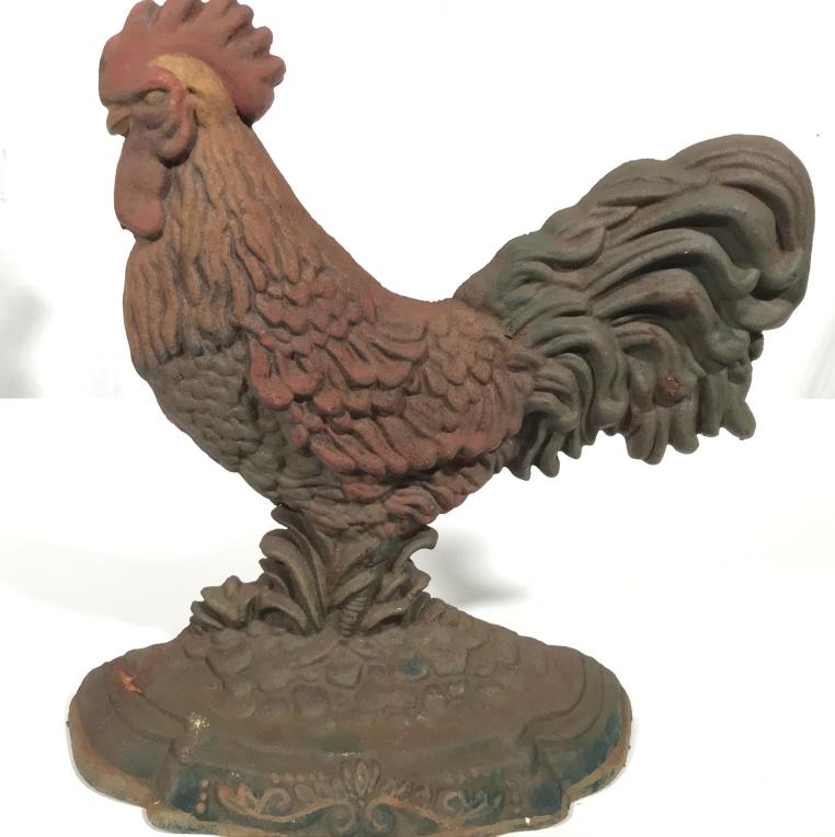 Antique Cast Iron Rooster Door Stop: This piece is an antique door stop. The piece is crafted from cast iron and resembles a rooster. The piece measures approx 11.25 inches H and 9.25 inches W. There is significant wear present due to th