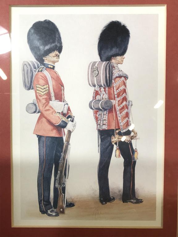 Vintage Framed Prints Depicting Soldiers: One print depicts red coats while other depicts solder playing drum. Prints are stacked vertically. Art, wall art, vintage art, soldier prints, War time art. Pieces are professionally framed and matte