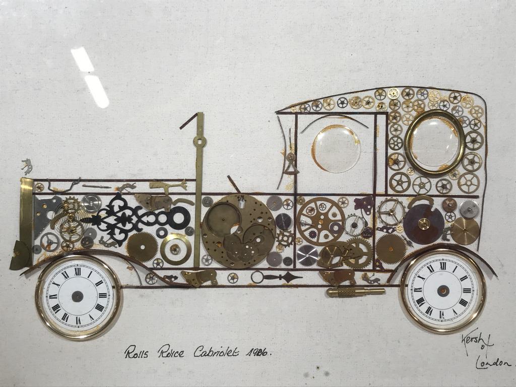 Framed KERSH OF LONDON Horological Collage: This piece is a framed collage from KERSH OF LONDON. The piece is assembled from gears, coils, and clock faces. The pieces have been rearranged to resemble a ROLLS ROYC CABRIOLET. The piece measures a