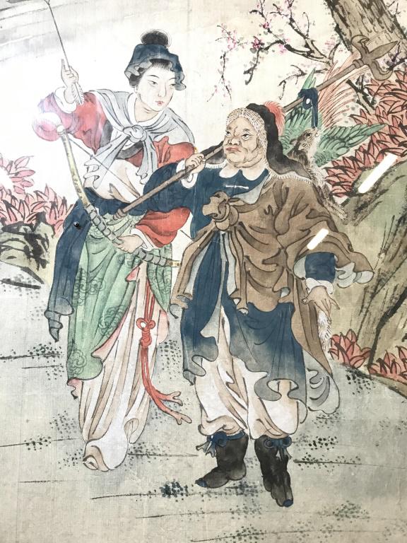 Lot 2 Vintage Framed Asian Paintings On Silk: Paintings are on silk. Each are professionally framed with black toned bamboo style frames. One depicts 3 figures and a donkey, the other depicts 2 Figurals with weapons. Both pieces have outdoor sett