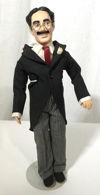 Vintage EFFANBEE Groucho Marx Figure: This piece is a vintage figure from EFFANBEE, the Figure is meant to resemble the comedian Groucho Marx. The piece measures approx 16.75 inches H and 7 inches W. There is some wear present on the piec