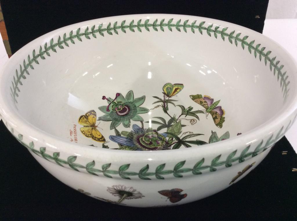 The Botanical Garden Ceramic Serving Bowl: Copyright reproduction design of various flowers with their scientific names. Flowers include daisy, aloe, meadow saffron, trailing bindweed, more. Underside reads ‘The Botanic Garden circa 1818 Por