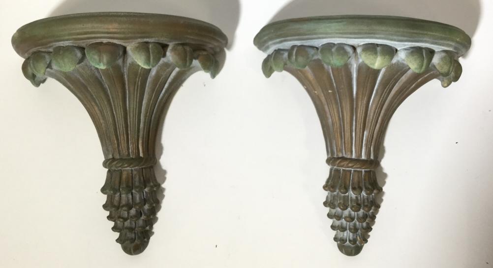 Pair Vintage Ceramic Shelves: Lot includes 2 shelves. Each shelf is crafted from ceramic. Both shelves feature detailing resembling leaves held together by braided rope. Pieces each Measure approx 8 inches tall 4.12 inches deep, 7