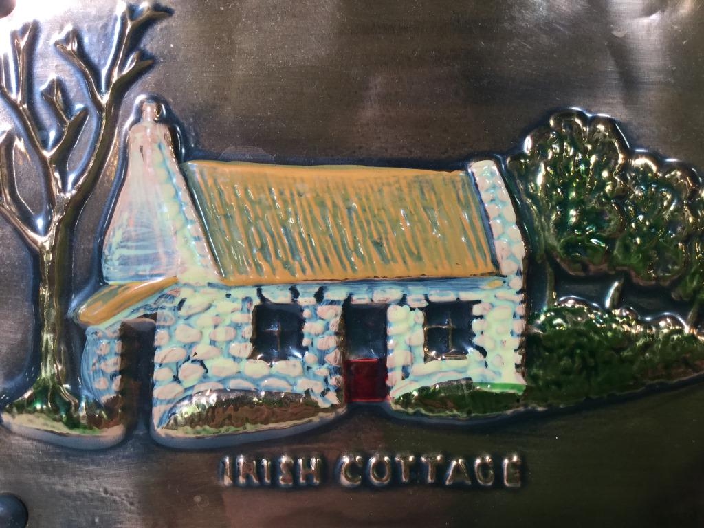 RATHBANNA Irish Cottage Copper Art: This piece is vintage home decor from RATHBANNA. The piece is Handpainted and depicts an Irish cottage. The image has been pressed into the copper, painted, and nailed to a wooden plaque. The piece me