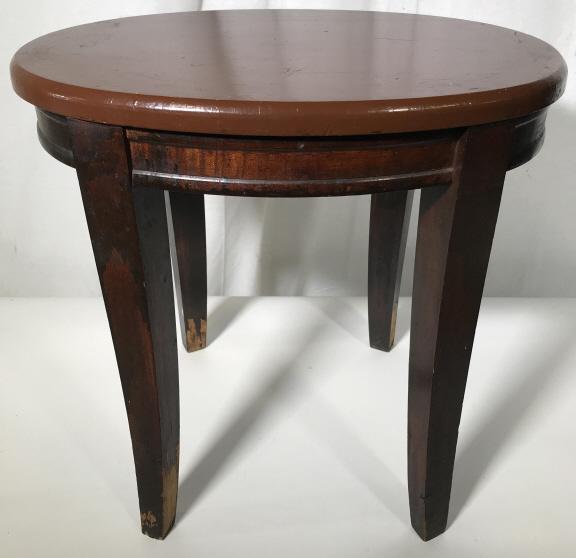 Vintage Carved Wooden Oval Shaped Side Table: Table is wooden & chocolate toned. Piece has 4 legs. Tabletop is oval shaped. Measures approx 17 inches tall and wide 14 inches deep. Vintage table, side table, wooden side table. Tabletop appears to 