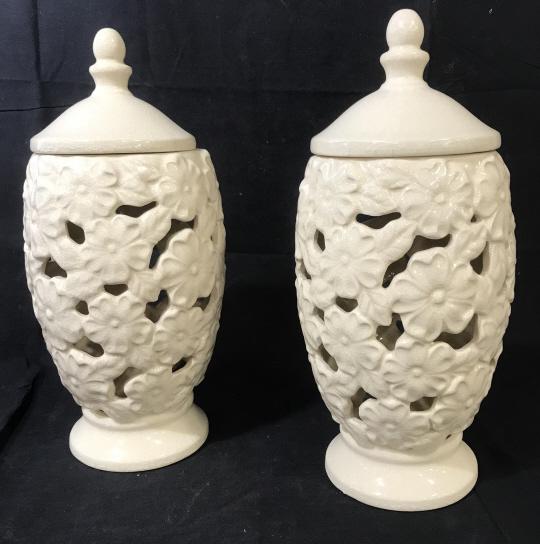 Pair Decorative Ceramic Lidded Lantern Vessel: Pierced ceramic vessel with neo classical knobbed lids, suitable for flame less candle or other decorative use. Crazed glaze adds to the this classic floral shapes. 14.5 in tall, 7.5 in wide. Tabletop