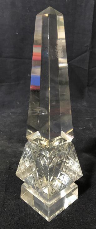 Lot 2 Cut Crystal Obelisks: Lot includes 2 obelisks. Each appear to possibly be cut Crystal. Obelisks, obelisk Figurals, tabletop accessories. Larger piece measures approximately 12 inches tall 2.75 inches square. 6
