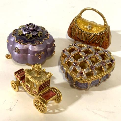 Lot 4 Pill Boxes and Carriage Figural: Lot includes 3 trinket boxes and one carriage figural. Trinket boxes include 1 purse shaped box, 1 heart shaped box, and 1 floral box. Floral box is marked Joan Rivers on bottom, measures approx 2 inc