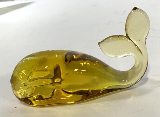 Lot 2 Glass Pear & Whale Paperweights: Lot of 2 paperweights. 1 paperweight is a pear with bubble pattern inside. Measures approx 4.5 inches tall. No signature or markings found. Other paperweight is a yellow toned whale measuring approxim