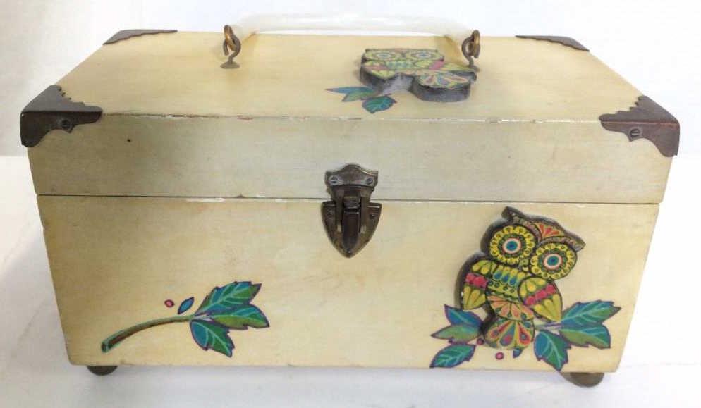 Decorative Owl Keepsake Box: With bakelite Style Handle, pearlescent composite material. Wood with heavy finish, pale tone, decorative owl designs on exterior, lined with pale with decorative print of floral filigree design on in