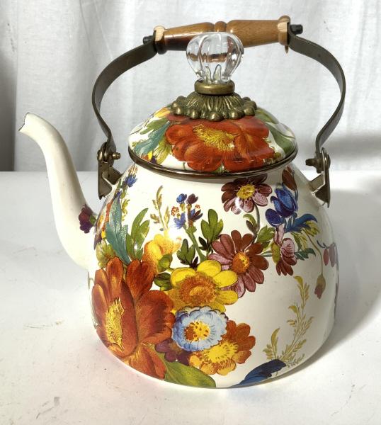 Hand Painted MACKENZIE-CHILDS Tea Kettle: This piece is a tea kettle from MACKENZIE-CHILDS. The piece is crafted from steel and has been glazed, the handle is crafted from an acrylic material. Floral prints decorate the piece. The underside r