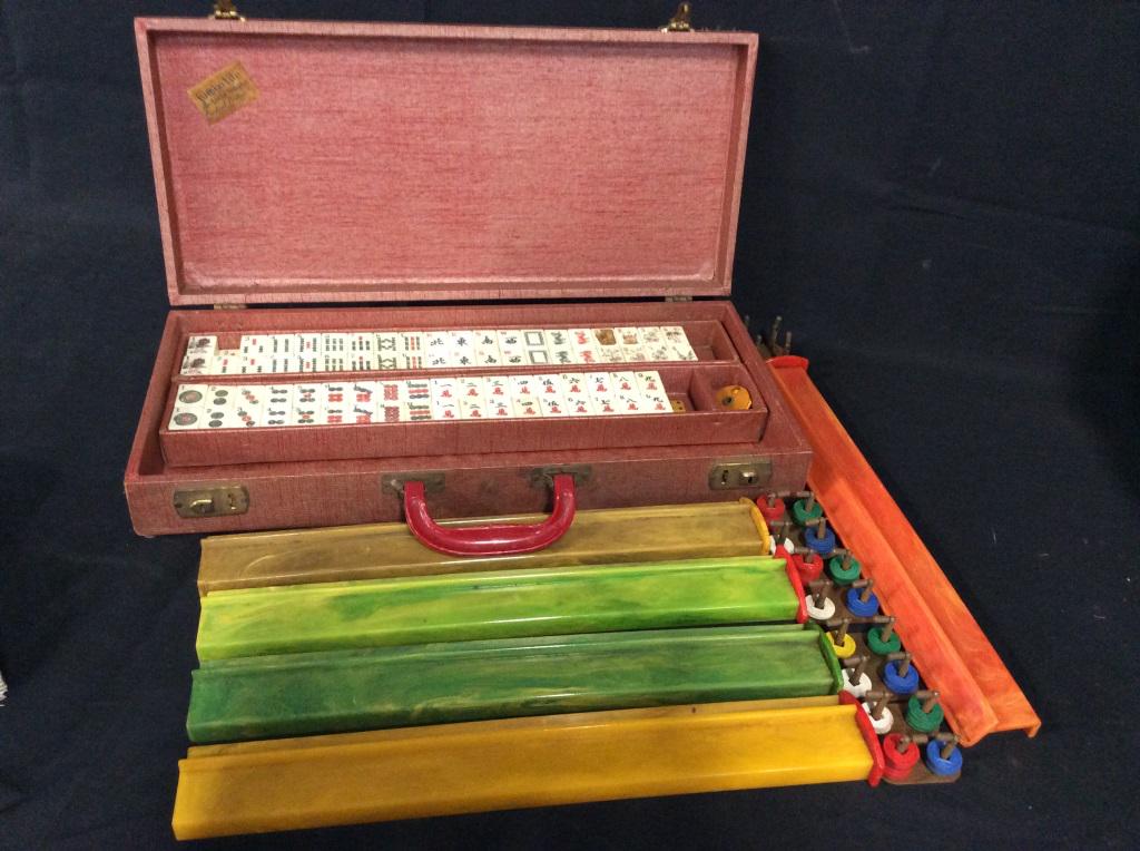 Vintage CARDINAL PRODUCTS Mahjong Set: This piece is a vintage mahjong set from CARDINAL PRODUCTS. The piece comes with a travel case, dice, several trays, and tiles. Several tiles are missing, the piece includes 151 tiles. The largest pie